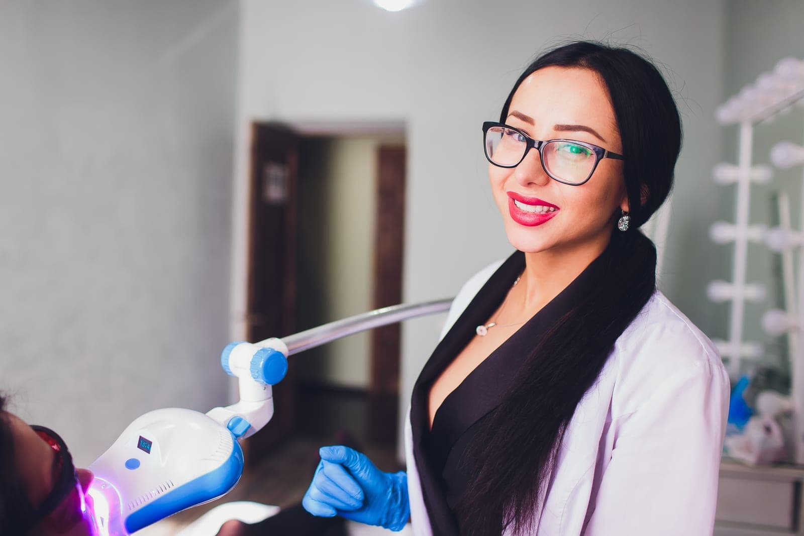 A dentist explaining dental implant treatment to a patient at Barbican Dental Practice